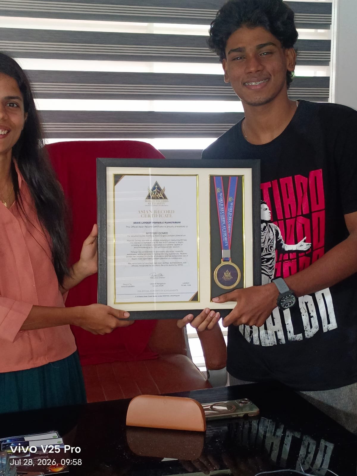 Mystery Domes team receiving the WRA Asia's Largest Portable Planetarium certificate and medal
